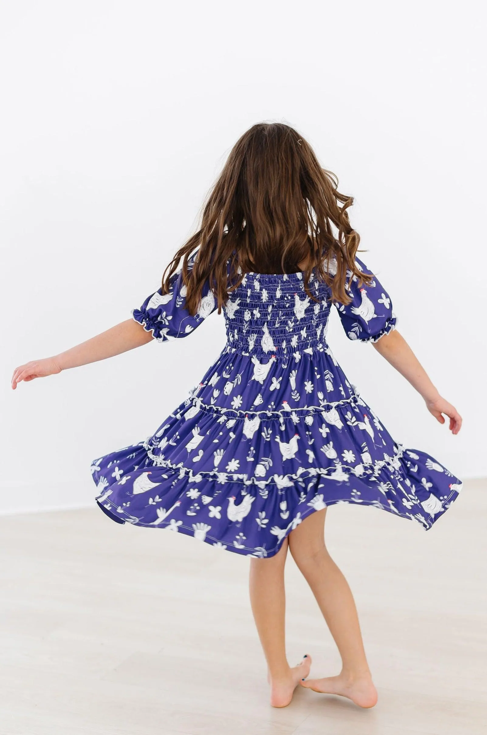 Feathered Friends Smocked Ruffle Dress